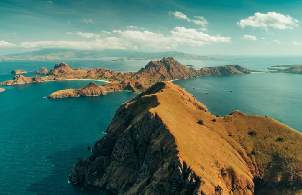 aerial shot cliffs and ocean of komodo park