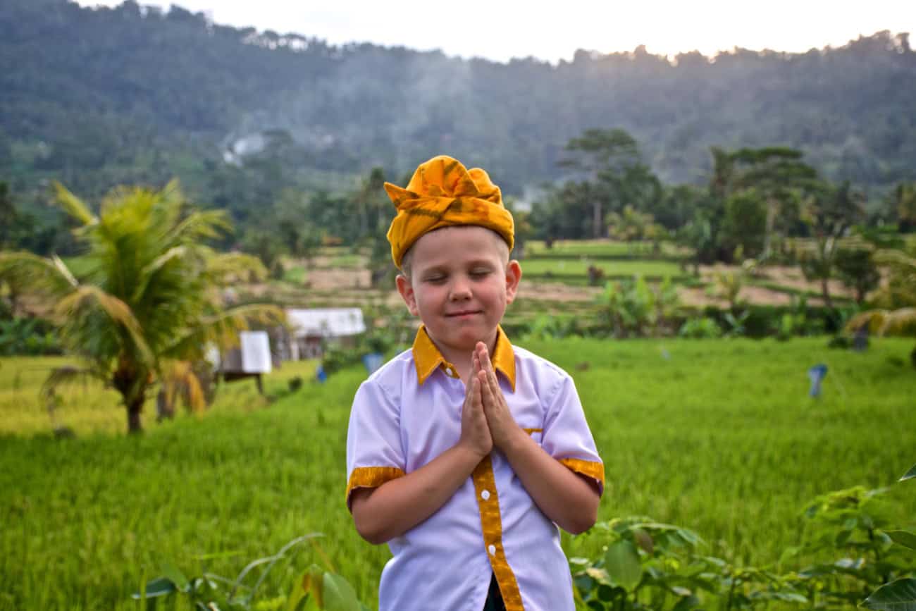 a boy in traditional balinese clothing